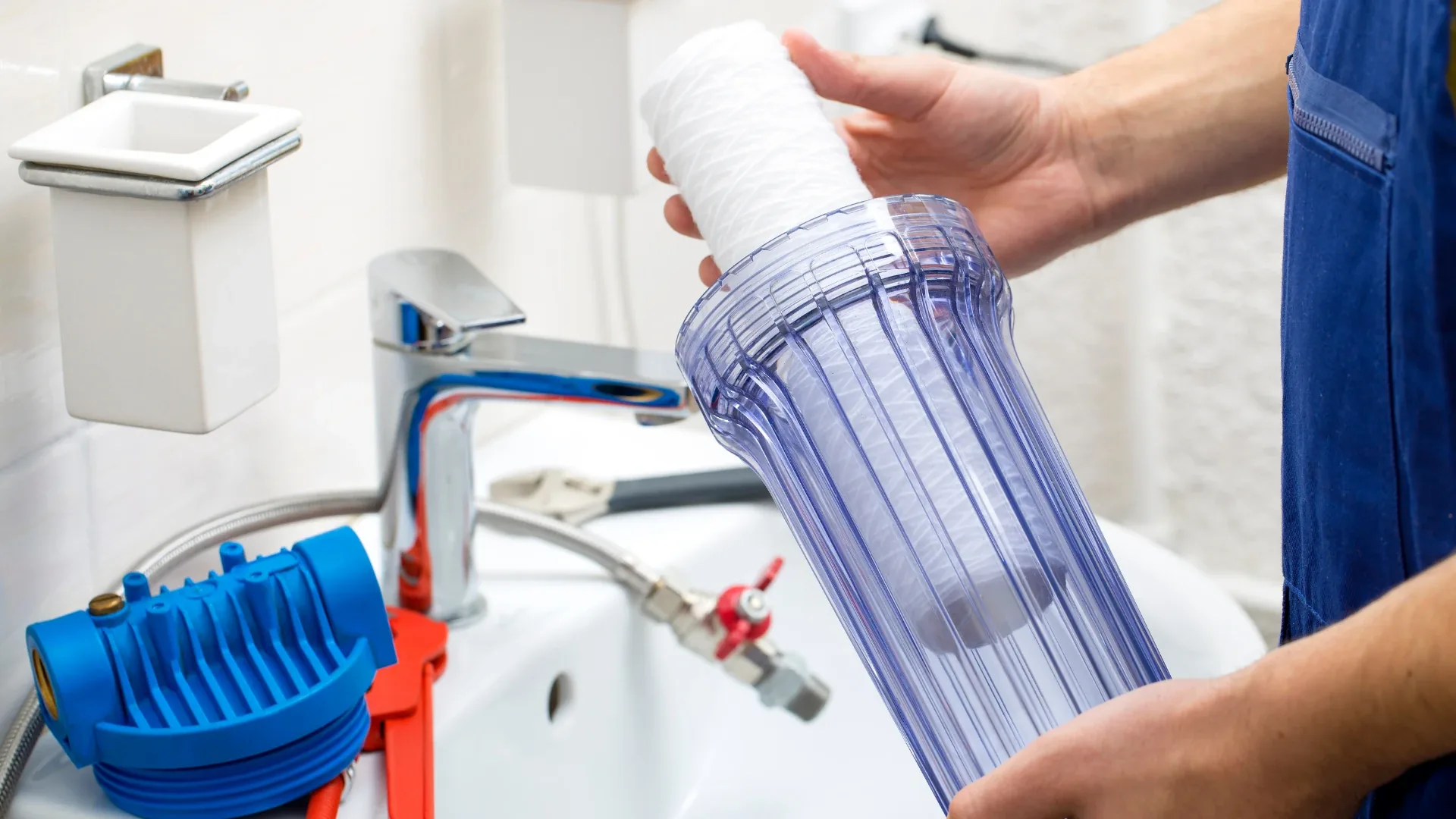 Technician replacing a water filter cartridge